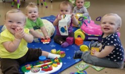 Babies Playing Together With Toys
