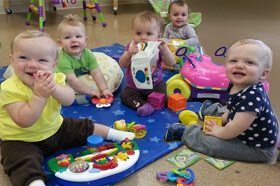 Babies Playing Together With Toys