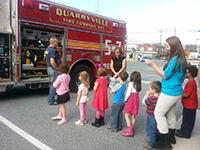 Children Looking at Fire Station 57 Fire Engine