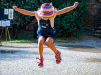 Young Girl Jumping Outside